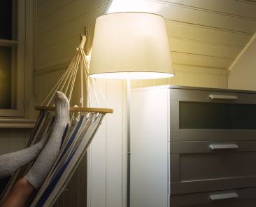 Woman wearing woolen stockings and lying in the hammock